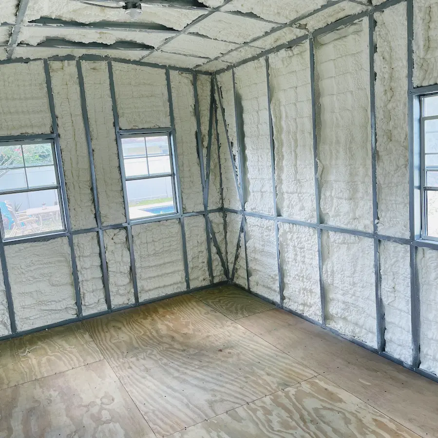 Closed-cell spray foam insulation applied to wall cavities in a residential project in Prairie Grove